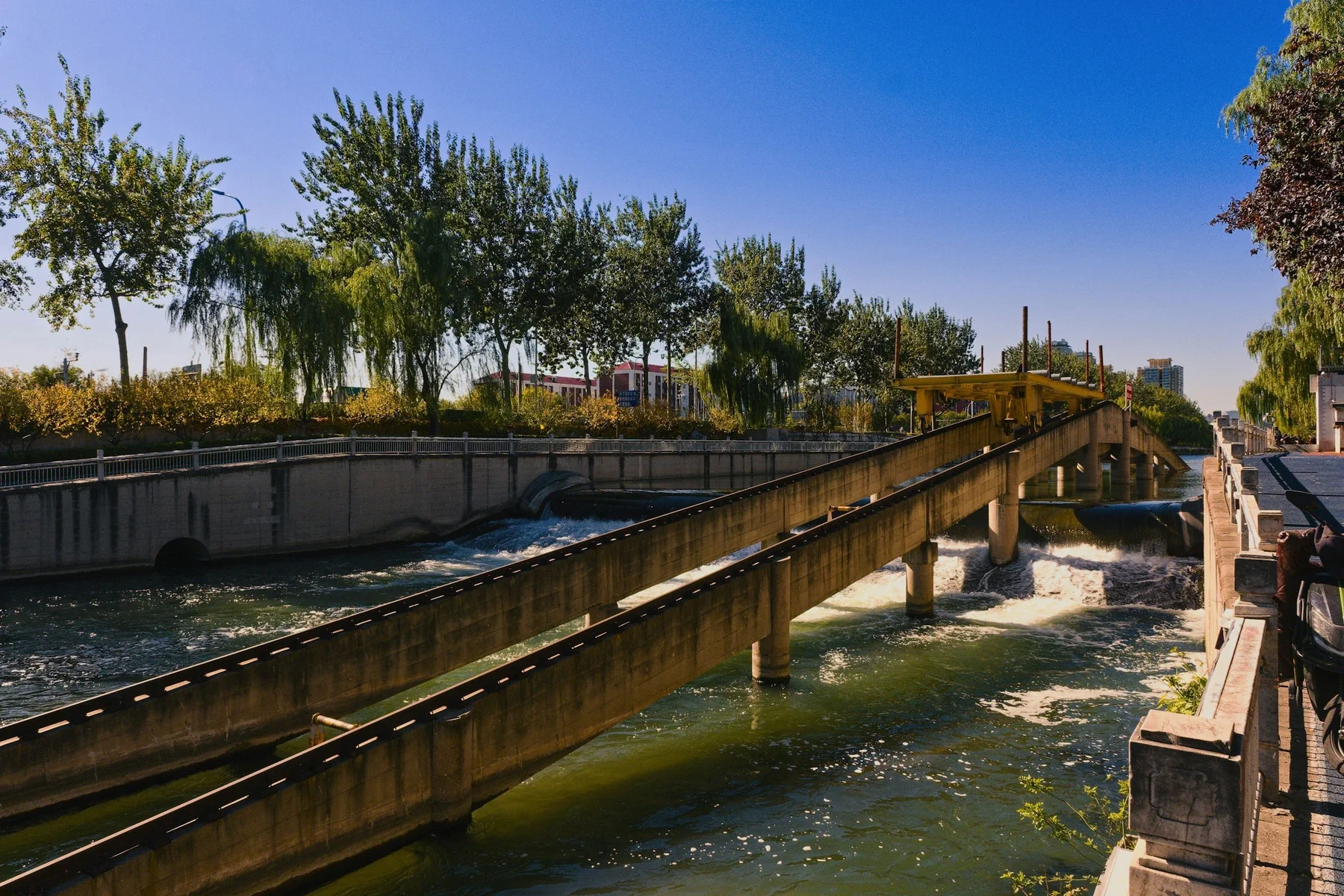 Concrete channels carrying water through an urban network
